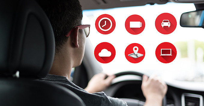 Man driving in a car with telematics installed